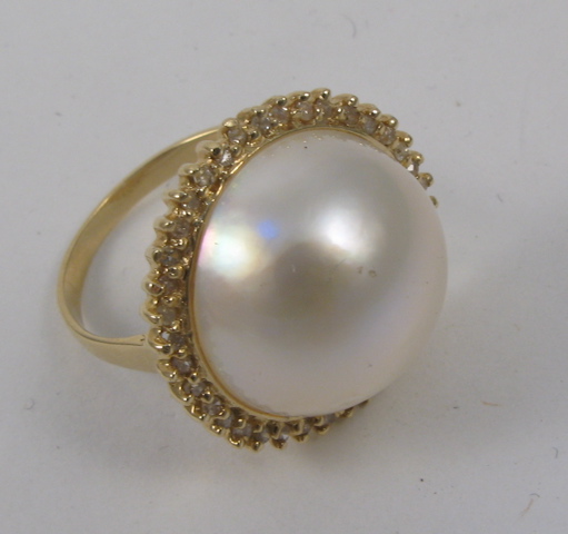 Appraisal: MABE PEARL AND DIAMOND RING k yellow gold and centering