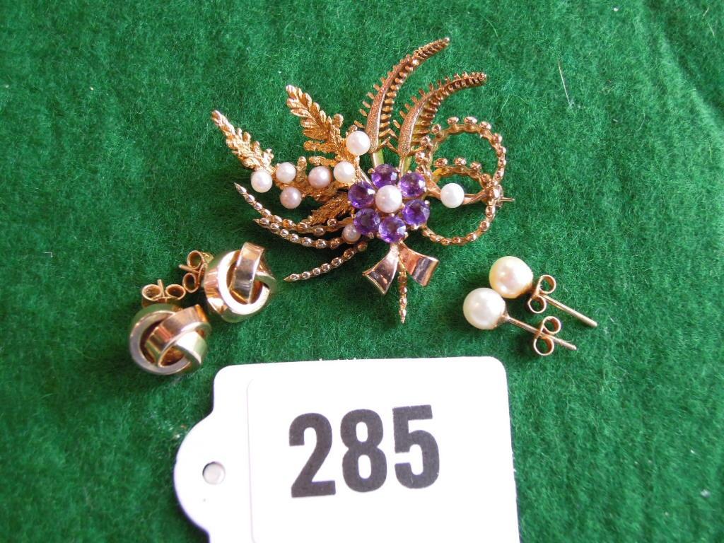 Appraisal: An amethyst and cultured pearl floral and foliate spray brooch