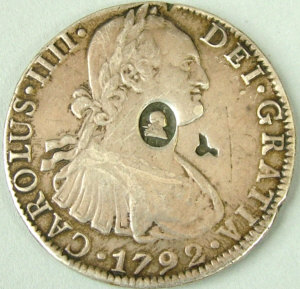 Appraisal: A George III dollar with oval counter mark on Spanish