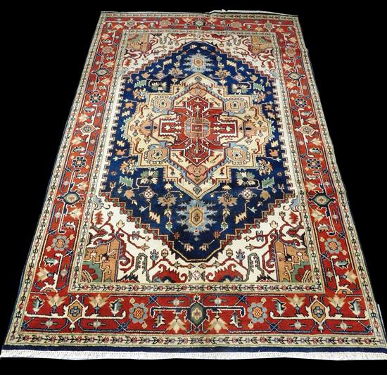 Appraisal: RUG Serapi navy field with accents of sand rust and