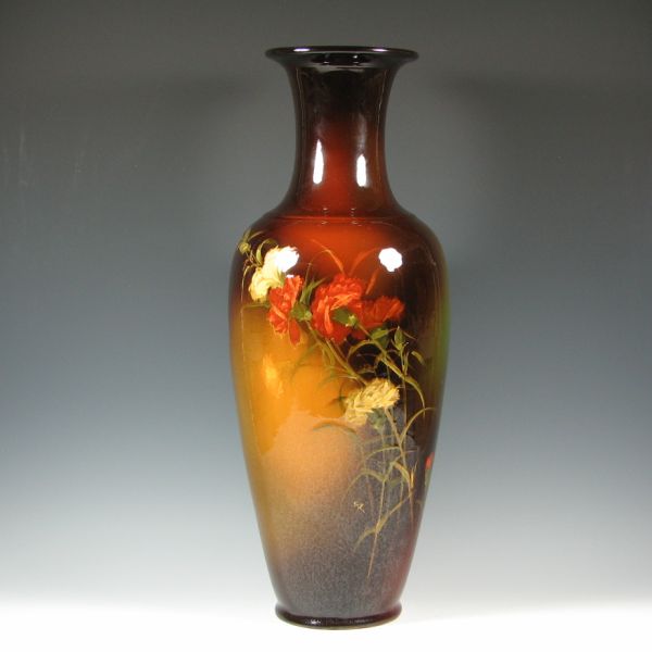 Appraisal: Tall Weller Louwelsa floor vase with lifelike carnations by Eugene