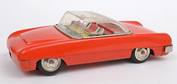 Appraisal: JAPANESE MASUDAYA BATTERY OPERATED TINPLATE FUTURISTIC CAR RED UNBOXED E