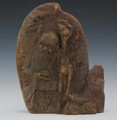 Appraisal: A Chinese Carved Hardstone of a Shaman with Reindeer Brown