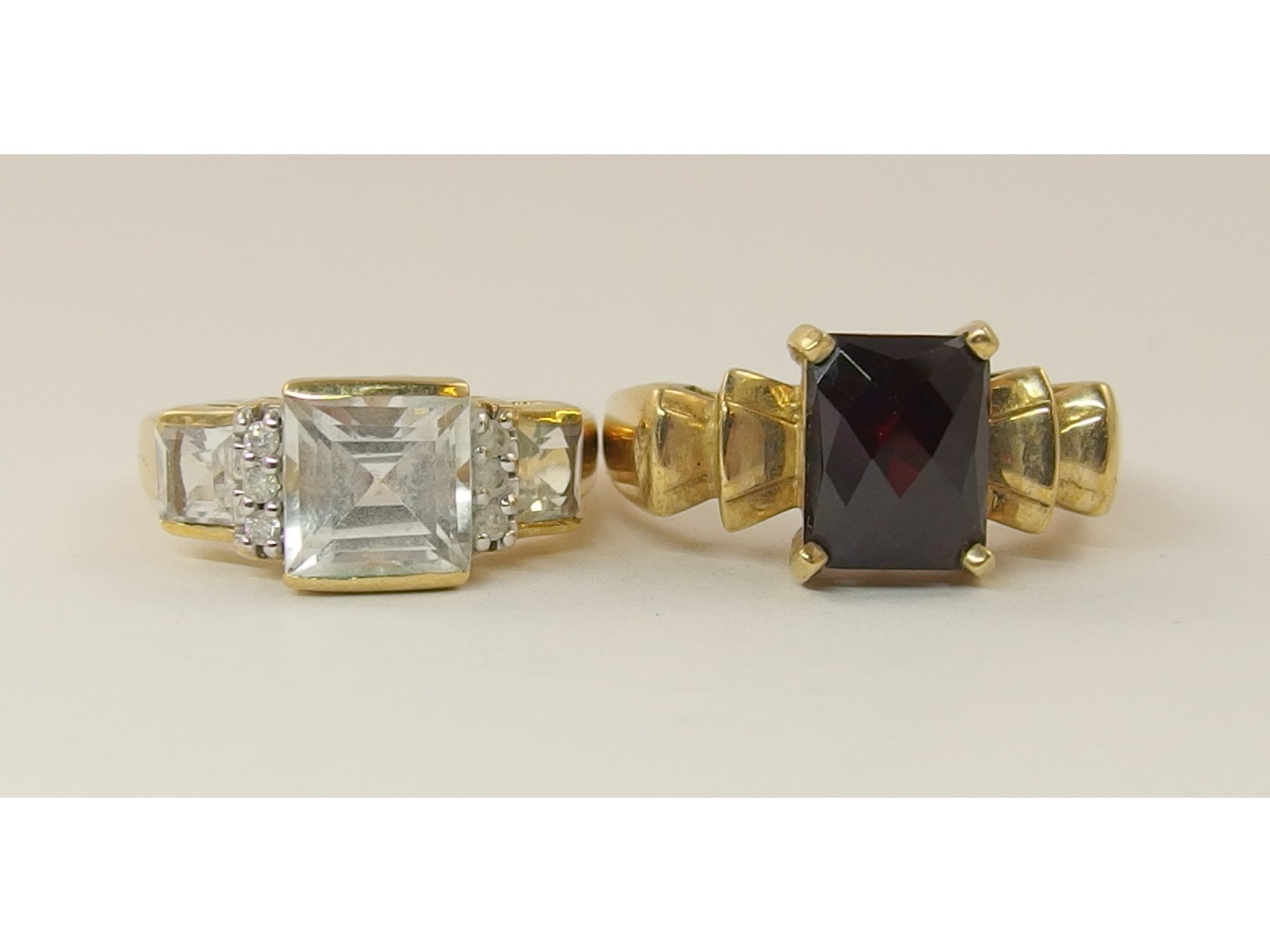 Appraisal: A ct garnet set ring with a diamond and gem