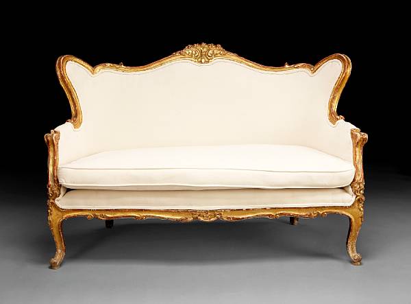 Appraisal: A Continental Rococo style carved giltwood settee late th century