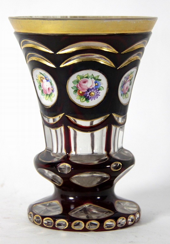 Appraisal: A Bohemian overlaid ruby glass beaker vase with circular panel