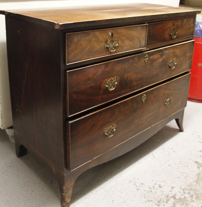 Appraisal: A George III mahogany chest the over hanging top raised