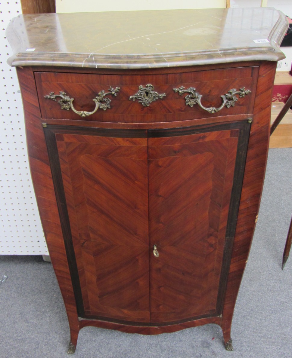 Appraisal: A late th century French marble topped serpentine side cabinet