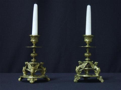 Appraisal: PAIR OF CONTINENTAL BRONZE CANDLESTICKS th century with caryatid tripod