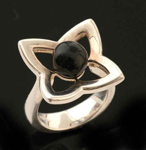 Appraisal: A sterling silver and onyx lotus ring by Hardy Bros