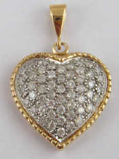 Appraisal: A carat yellow and white gold diamond pendant heart shape