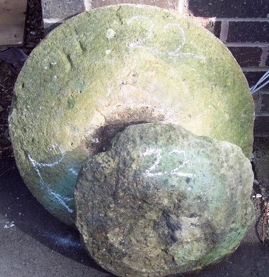 Appraisal: A circular staddle stone top and another