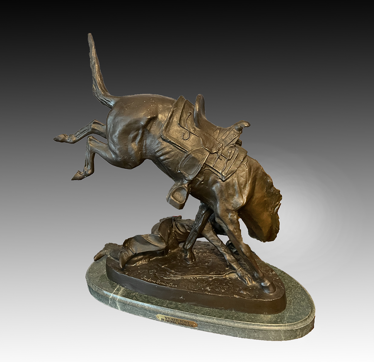 Appraisal: AFTER FREDERIC REMINGTON ''WICKED PONY'' BRONZE Bronze sculpture on marble