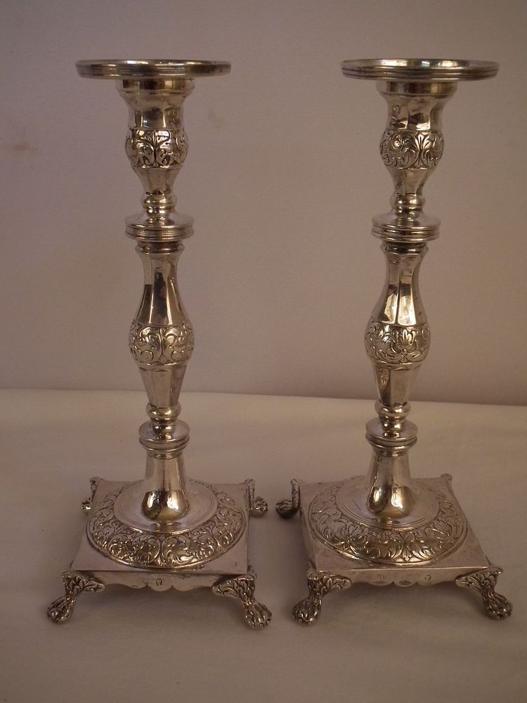 Appraisal: ANTIQUE PORTUGESE SILVER CANDLESTICKS Pair of solid silver Portugese candlestick