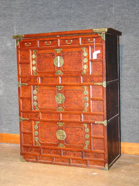 Appraisal: A Korean three-tiered mixed wood cabinet Each tier fronted by