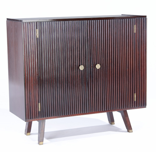 Appraisal: OSVALDO BORSANI Mahogany cabinet with ribbed doors and brass pulls