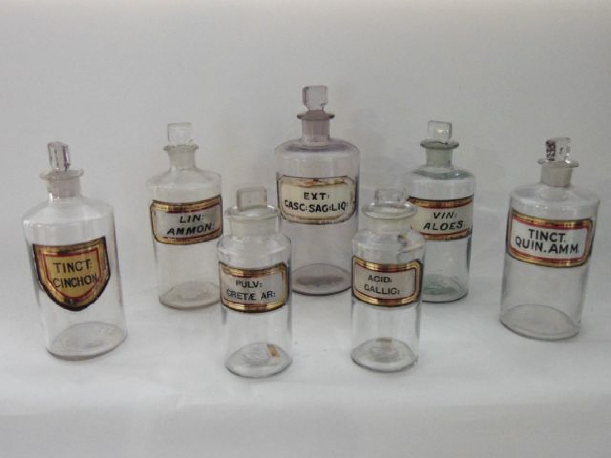 Appraisal: Seven various th century clear glass chemist's flasks bottles of