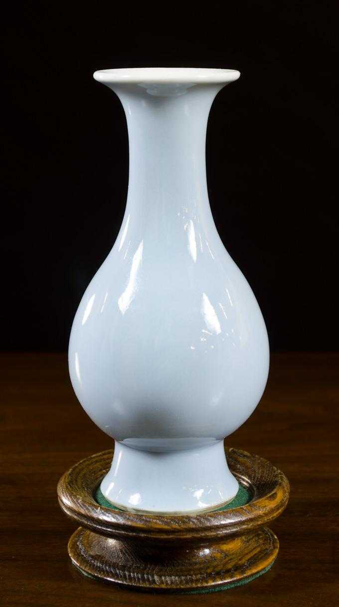 Appraisal: CHINESE CLAIR-DE-LUNE MOONLIGHT GLAZE PORCELAIN VASE with hardwood plinth pear