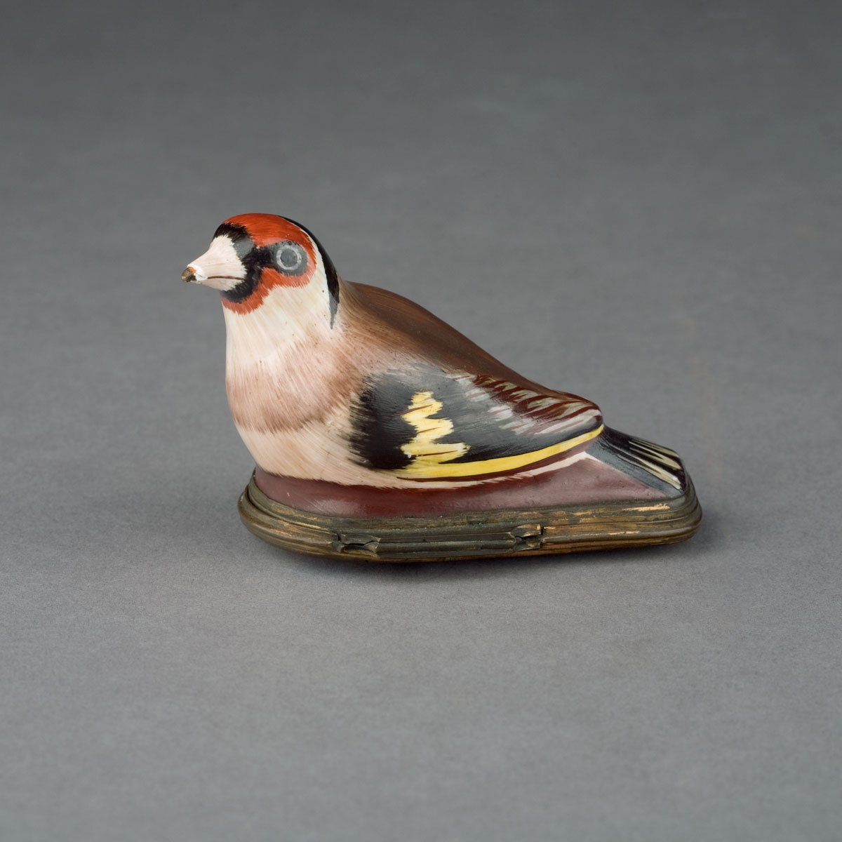 Appraisal: BILSTON ENAMEL EUROPEAN GOLDFINCH BONBONNIERE AND COVER CIRCA The head