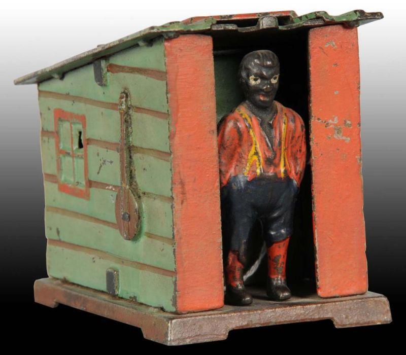 Appraisal: Cast Iron Cabin Mechanical Bank Description Manufactured by J E