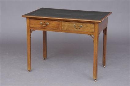 Appraisal: GEORGE III MAHOGANY WRITING TABLE The molded top with green