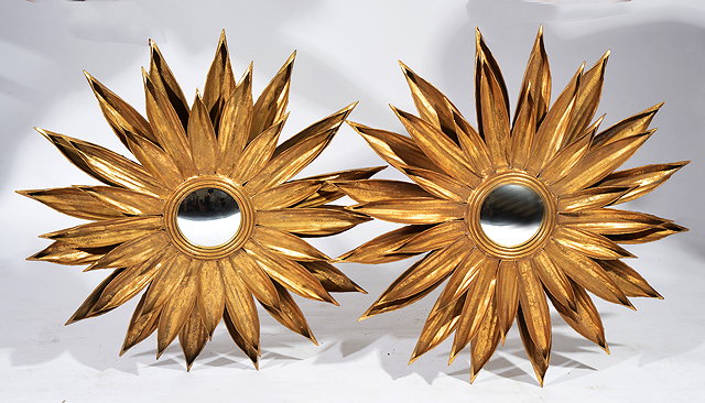 Appraisal: A PAIR OF GOLD PAINTED METAL SUN FLOWER TYPE WALL