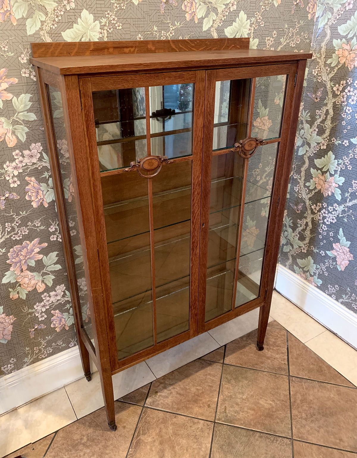 Appraisal: AMERICAN OAK BOOKCASE Oak bookcase having glass front doors each