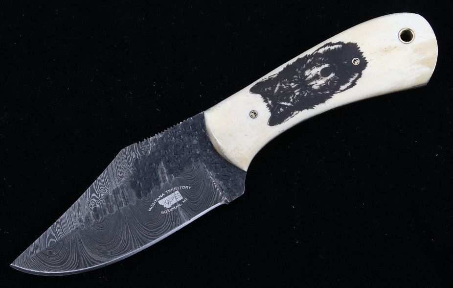 Appraisal: Montana Wolf Scrimshaw Damascus Knife Bozeman This is an original