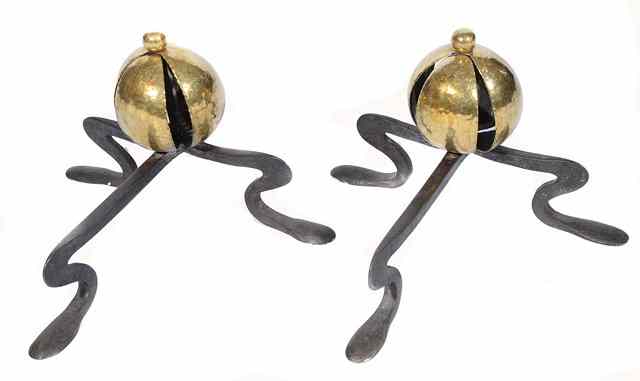 Appraisal: A pair of Arts Crafts hammered brass and wrought iron