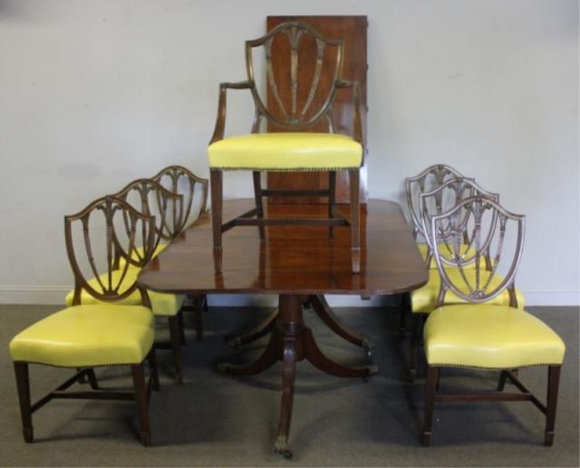 Appraisal: Mahogany Twin Pedestal Dining Table and Shieldback Chairs Labeled Made