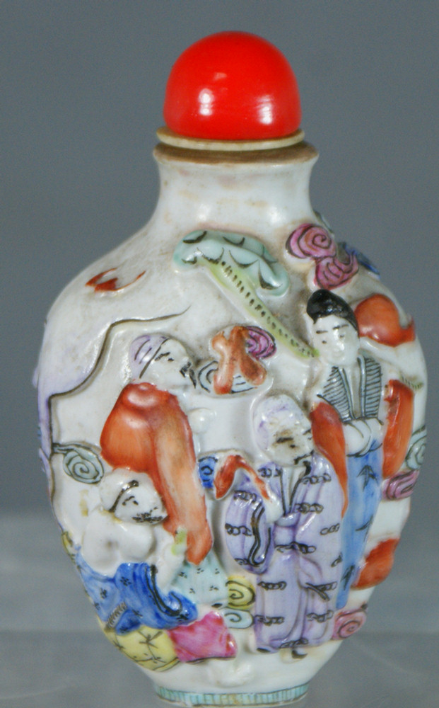 Appraisal: Molded porcelain snuff bottle figures in a landscape signed on