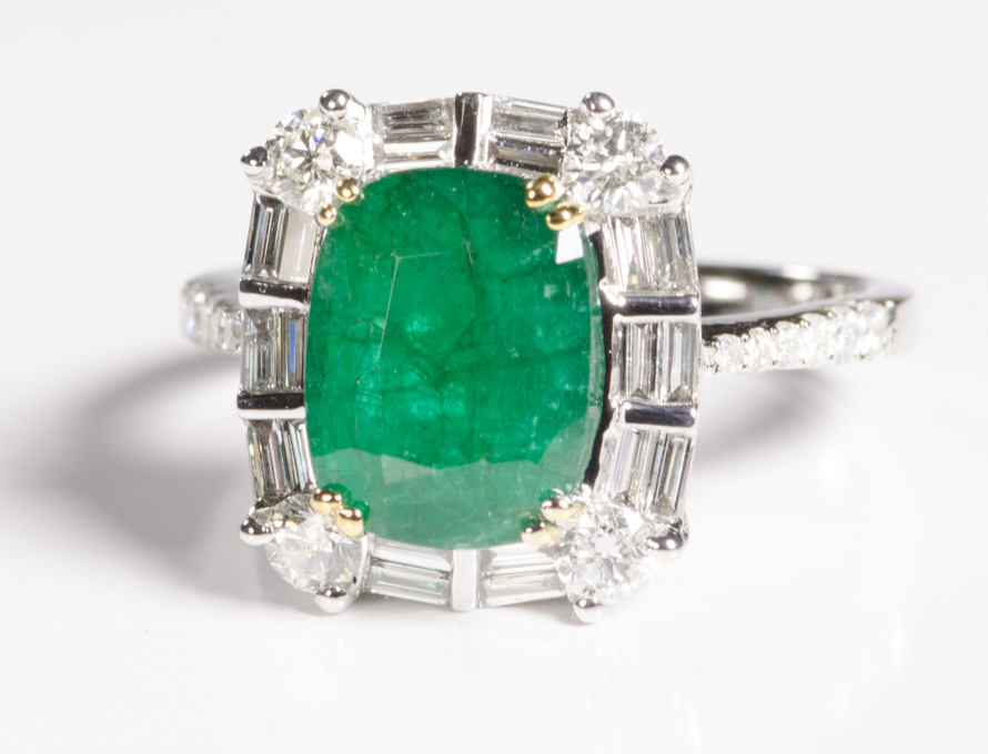 Appraisal: DIAMOND EMERALD AND FOURTEEN KARAT WHITE GOLD RING centering a