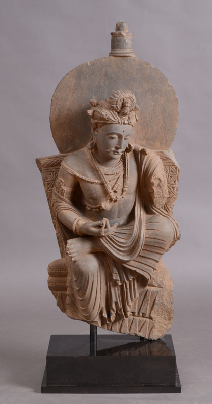 Appraisal: GANDHARAN CARVED SCHIST FIGURE OF A BODHISATTVA Modeled seated with