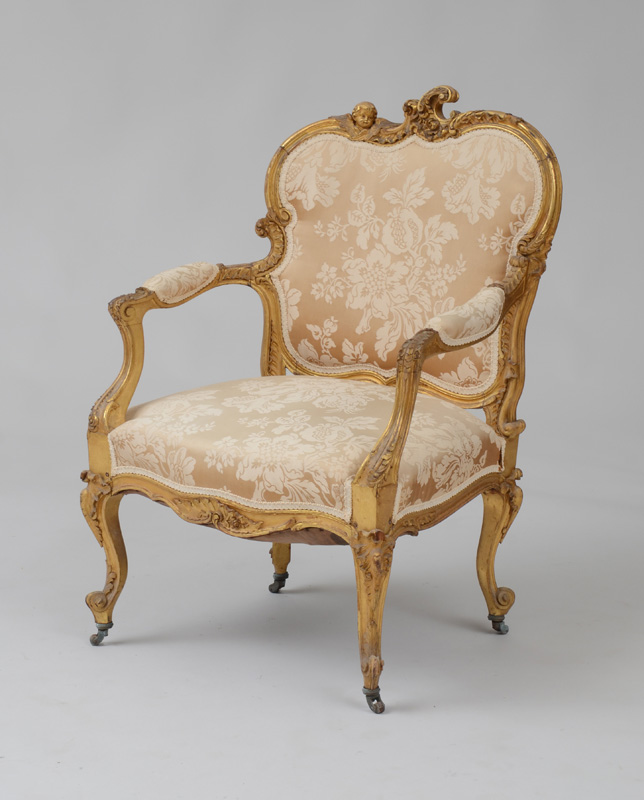 Appraisal: GERMAN ROCOCO STYLE GILTWOOD ARMCHAIR With an asymmetrical cartouche-shaped upholstered