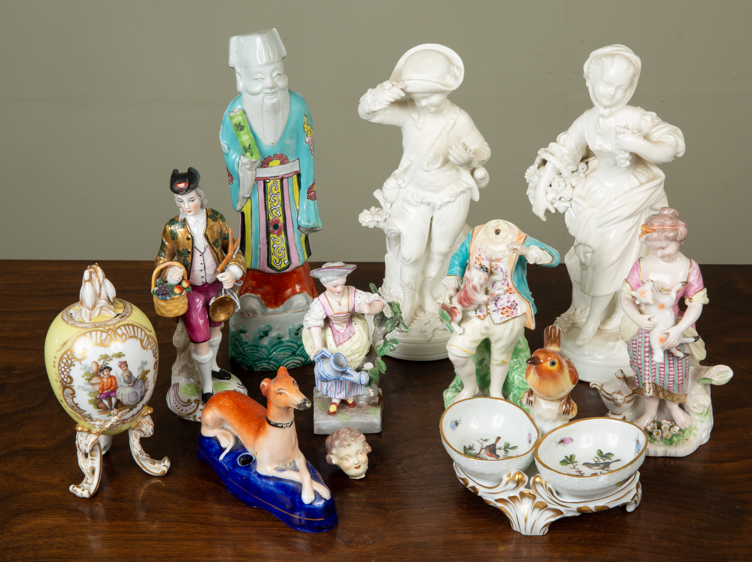 Appraisal: A group of decorative porcelain to include a bow figurine