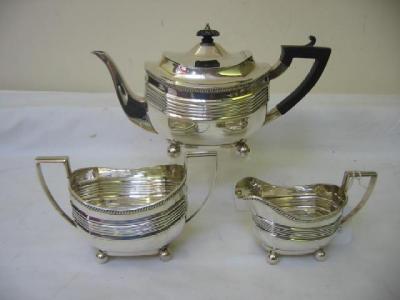 Appraisal: A THREE PIECE TEA SET of panelled oval form with