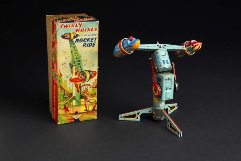 Appraisal: Tin Twirly Whirly Rocket Ride Battery-Op Toy Description Japanese Working