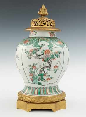 Appraisal: A Large Chinese Porcelain Jar with Gilt Mounts The hand