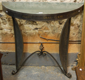 Appraisal: A contemporary design wrought iron demi-lune console table with inset