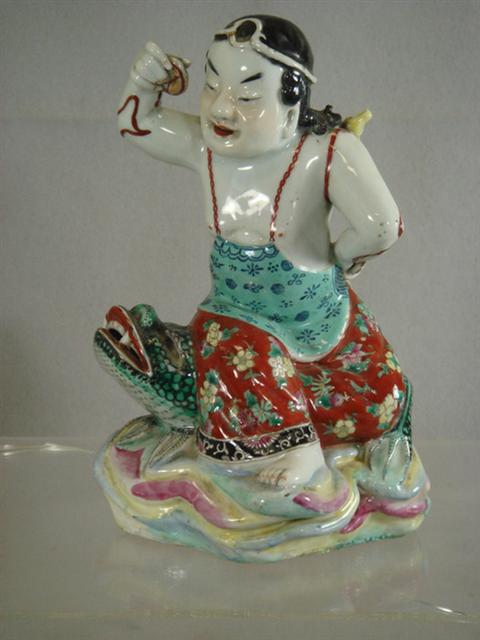 Appraisal: Chinese porcelain figure of a child on a frog th