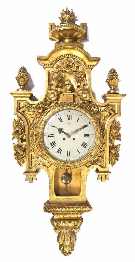 Appraisal: A Louis XVI Style Giltwood Cartel Clock having a flaming