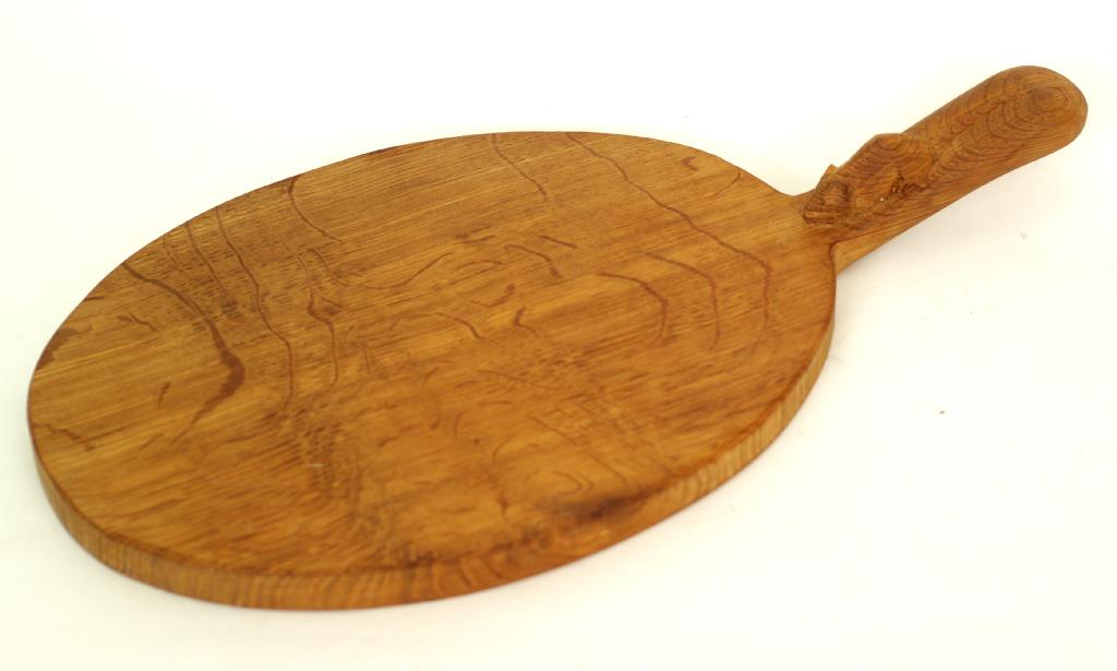 Appraisal: ROBERT MOUSEMAN THOMPSON OAK CHEESE BOARD of oval form and