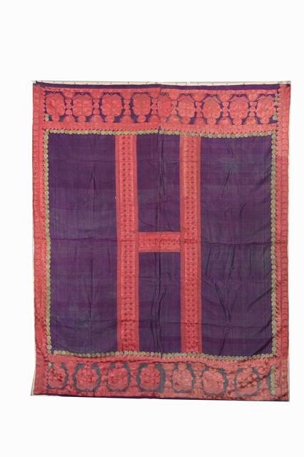 Appraisal: AN OLD INDIAN SIND AUBERGINE SILK WALL HANGING with red