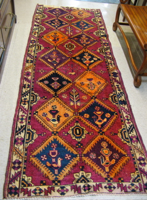 Appraisal: PERSIAN HALL RUG colorful repeating panel design ' x '