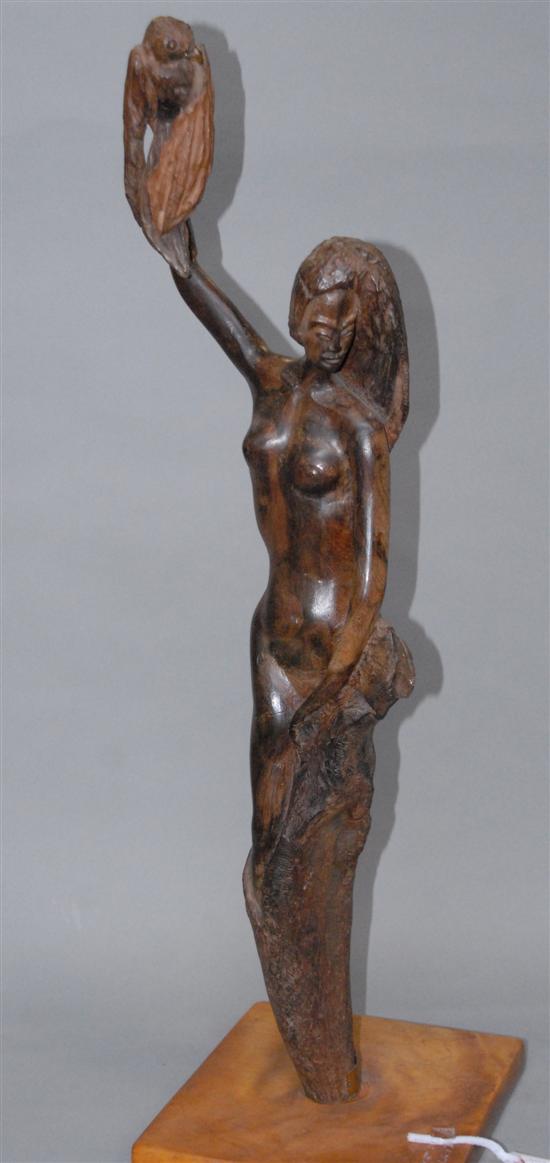 Appraisal: CARVED FEMALE FIGURE Wood standing and holding a bird Signed