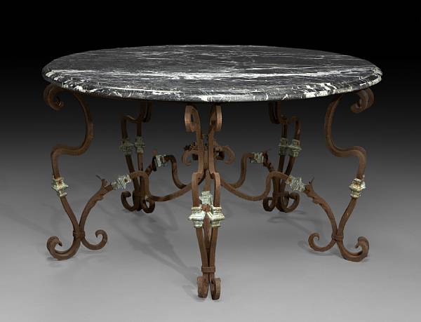 Appraisal: A Baroque style marble bronze and wrought iron center table