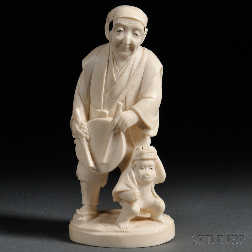 Appraisal: Ivory Okimono of a Man with a Monkey Japan th