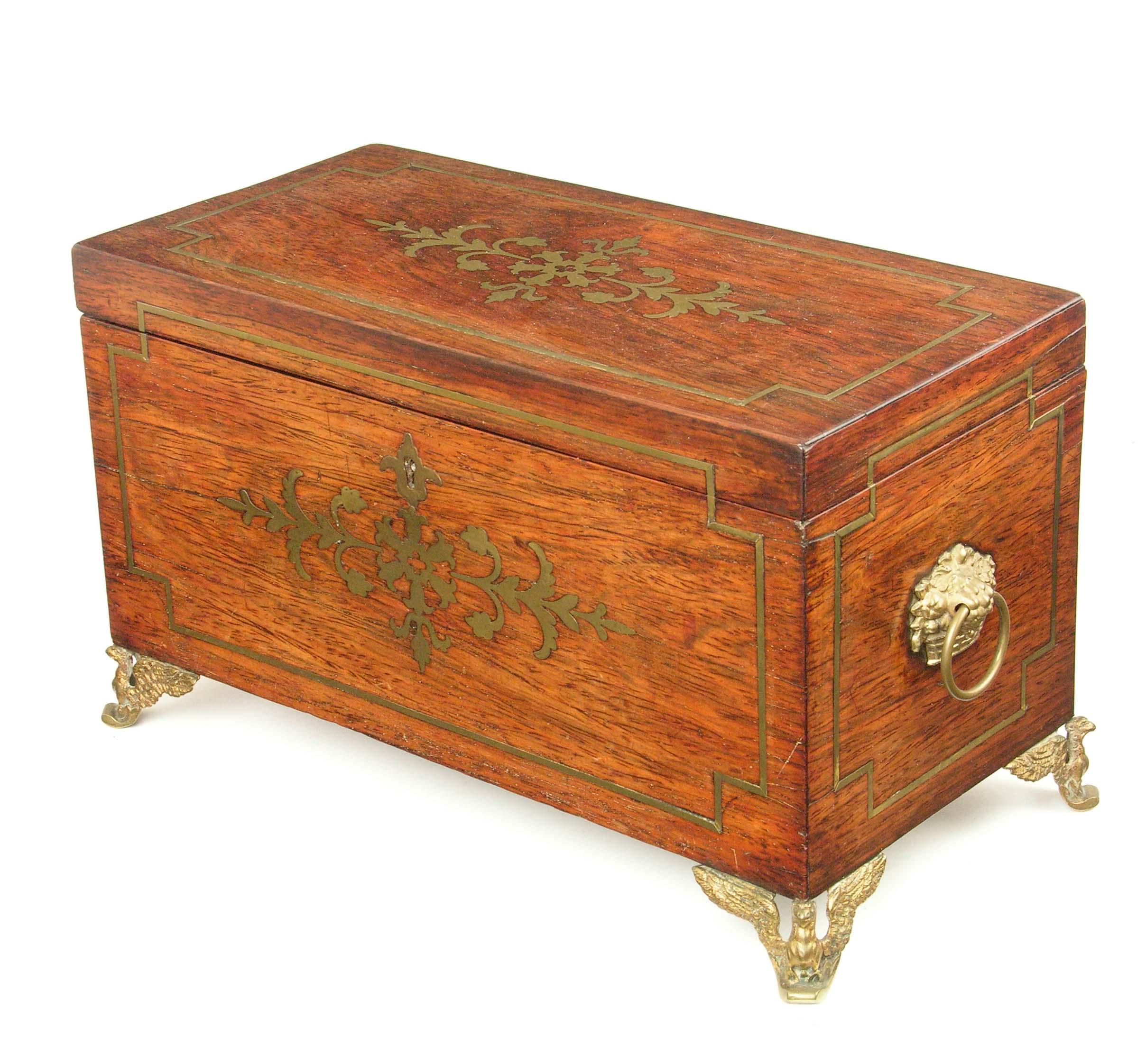 Appraisal: A Regency rosewood and brass marquetry tea caddy