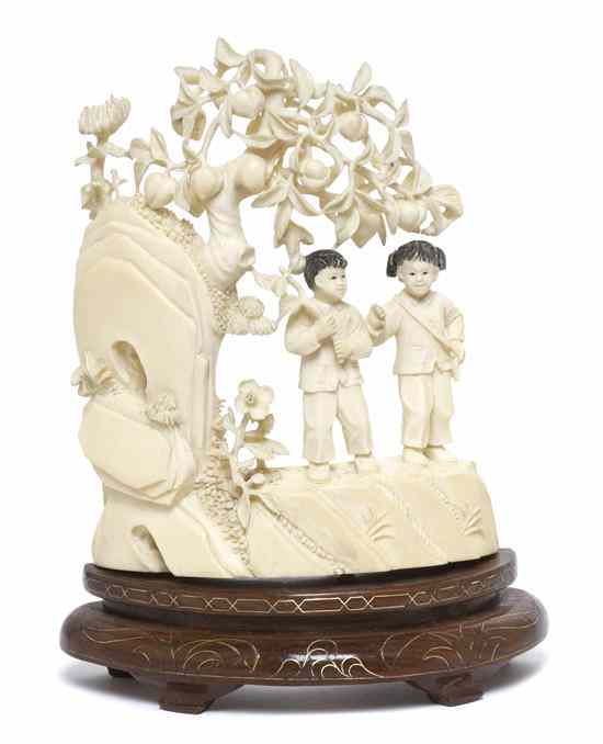 Appraisal: A Chinese Ivory Carving of Children Under a Peach Tree