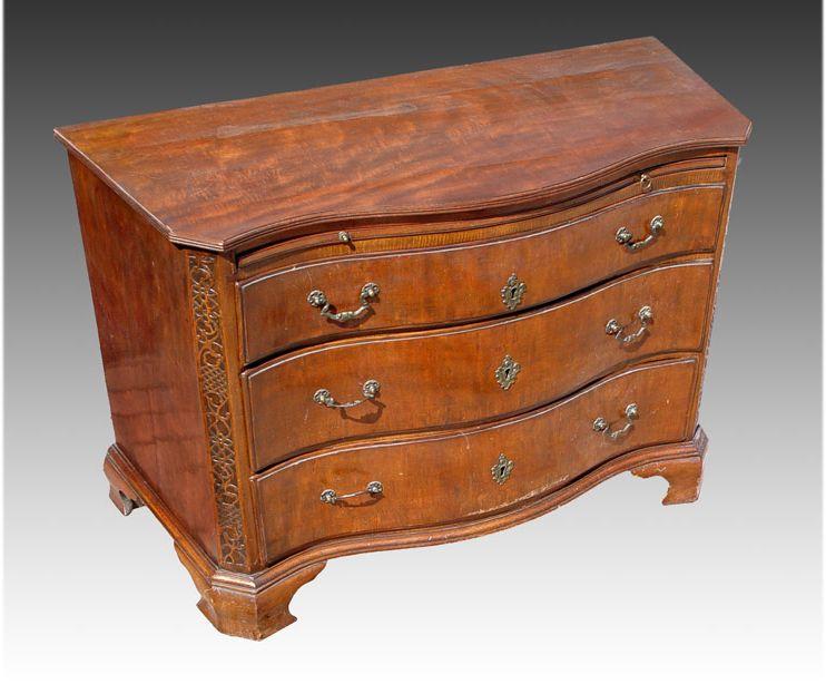 Appraisal: TH C ITALIAN WALNUT SERPENTINE CHEST Canted corners with Chippendale